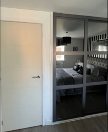 Bedrooms Plus sliding wardrobe doors installed by IM Joinery Ltd