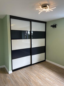 Bedrooms Plus sliding wardrobe doors installed by DNA Prestige